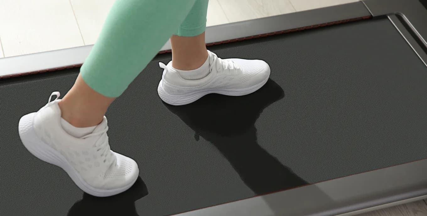 Walking on a compact treadmill at home